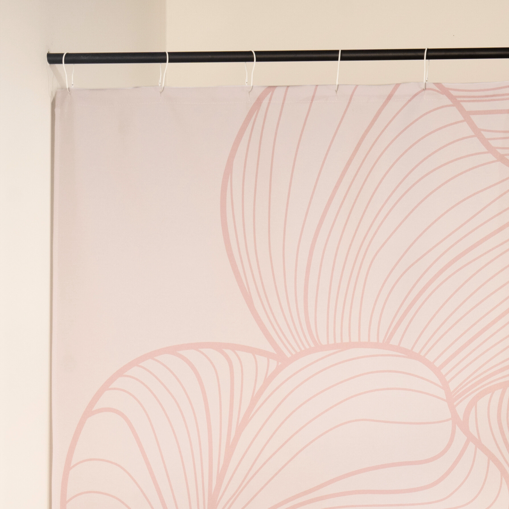 Close detail of the mauve line curves drawn on the cream cloth