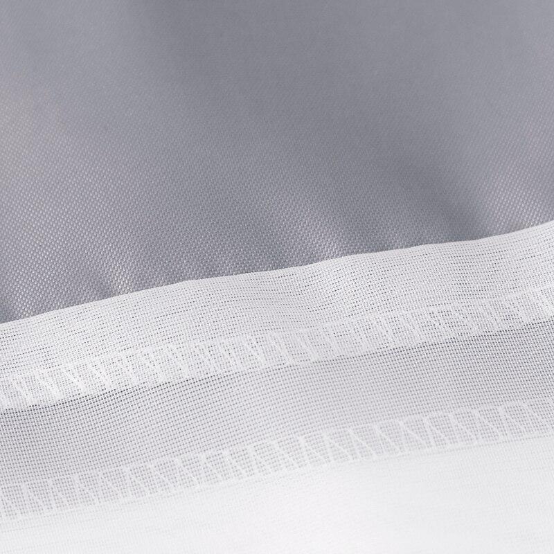 Close detail of the embossed grey texture beside the white band