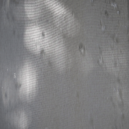 Weighted lower hem holding the abstract panel in a straight fall