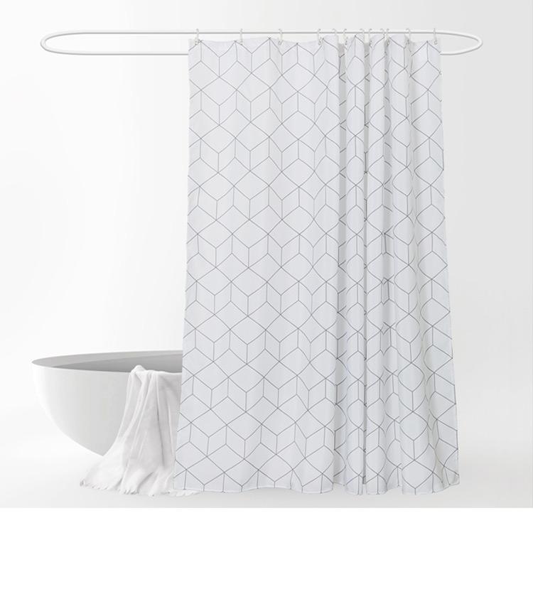 Close view of the thin grey geometric linework on white fabric