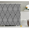 Concentric black diamonds in a dense aztec pattern across a white ground