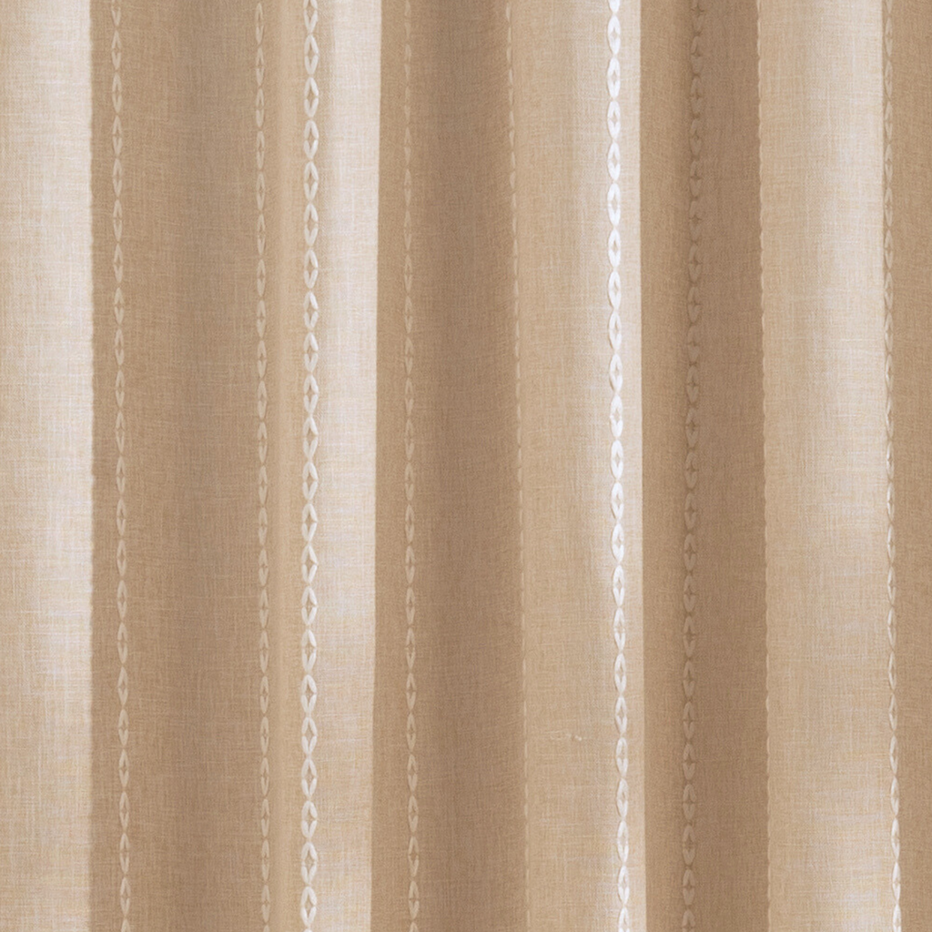 Weighted lower hem keeping the beige panel hanging evenly straight