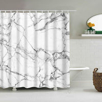 Fine branching grey veins across white in a Carrara marble look