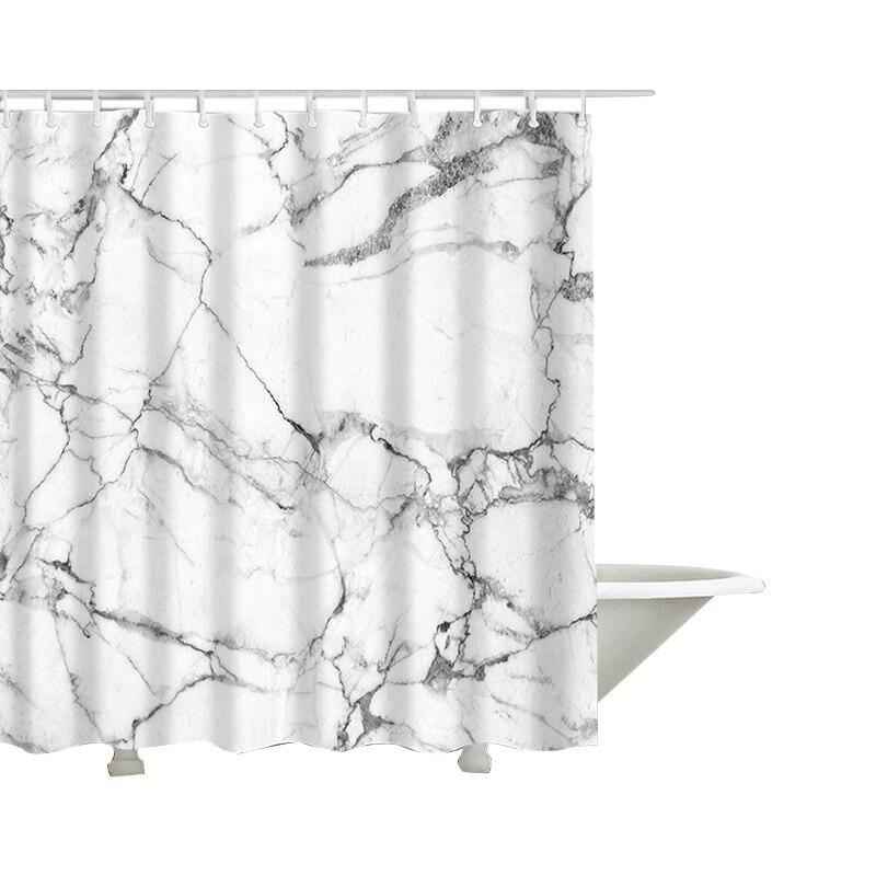 Close detail of the grey marble veining on the matte white ground
