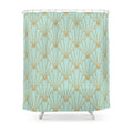 Gold line art deco fans staggered across a pale aqua curtain ground