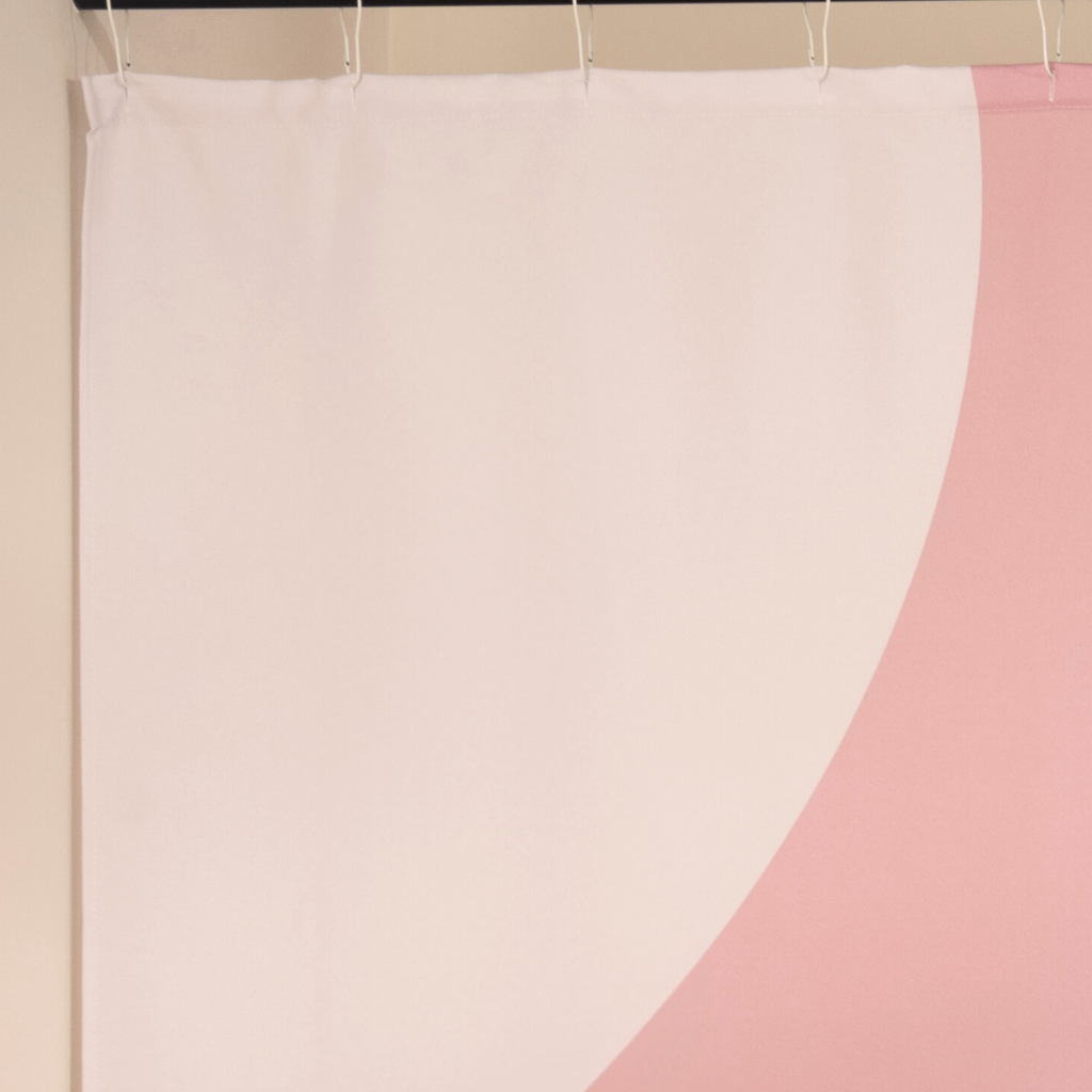 Close detail of the white teardrop leaves against the plain pink