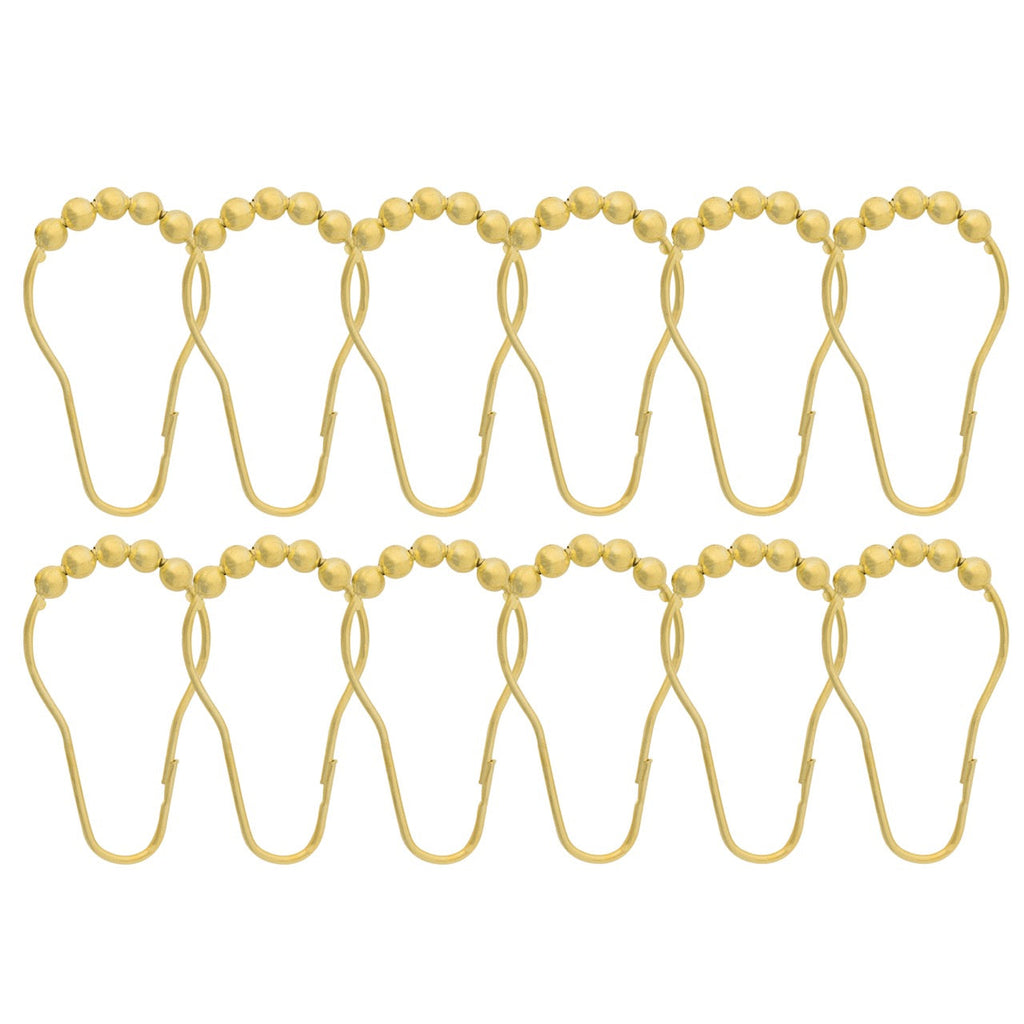 Twelve gold curtain rings each crowned with a row of metal balls
