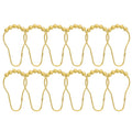 Twelve gold curtain rings each crowned with a row of metal balls