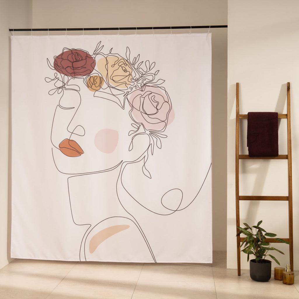 Single line female face crowned with ochre and blush painted roses
