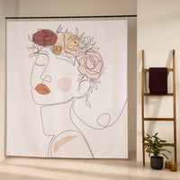 Single line female face crowned with ochre and blush painted roses