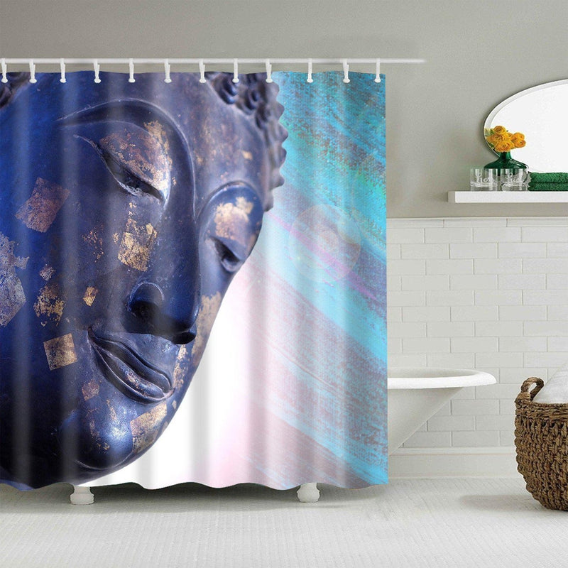 Deep indigo Buddha face with gold leaf flecks on a textured navy panel