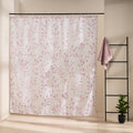 Small watercolor sprigs of mauve pink blossom scattered on off-white