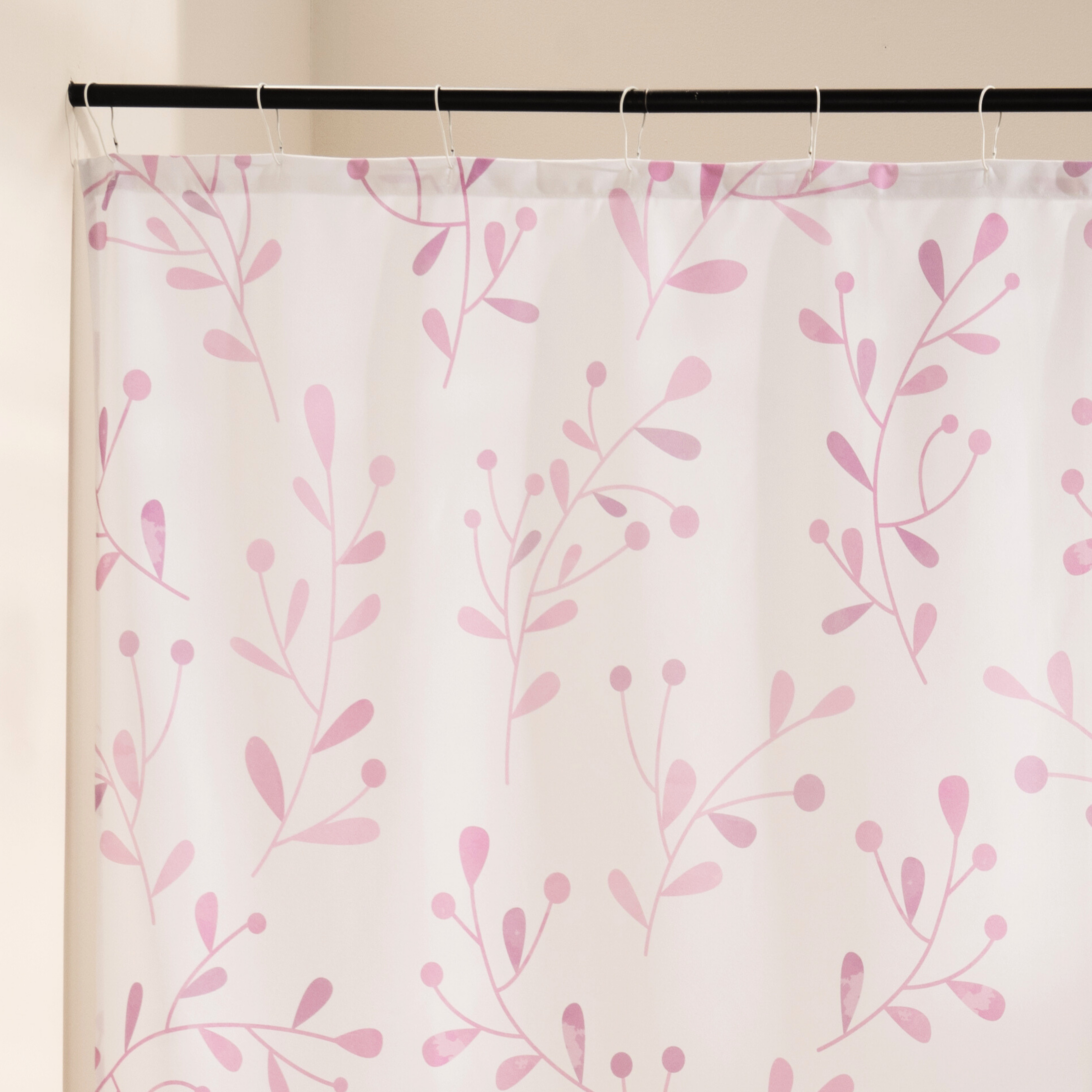 Close detail of a painted pink sprig on the cream woven ground