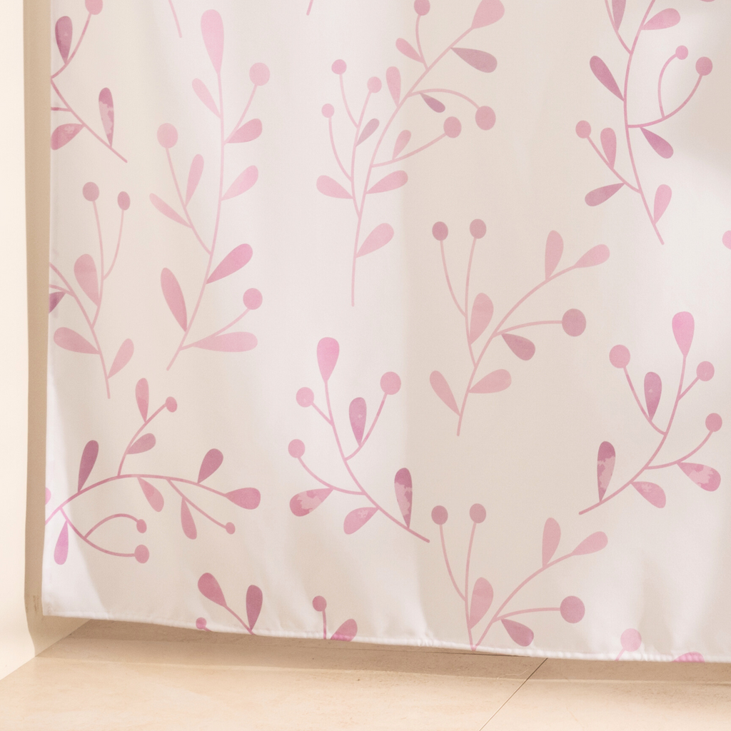 Full length neutral floral curtain hanging beside a glass screen