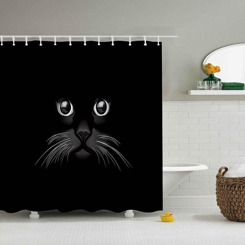 Only the eyes nose and white whiskers of a cat emerging from black