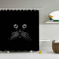 Only the eyes nose and white whiskers of a cat emerging from black