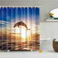 Dolphin leaping clear of the ocean at sunset with golden reflections on the waves