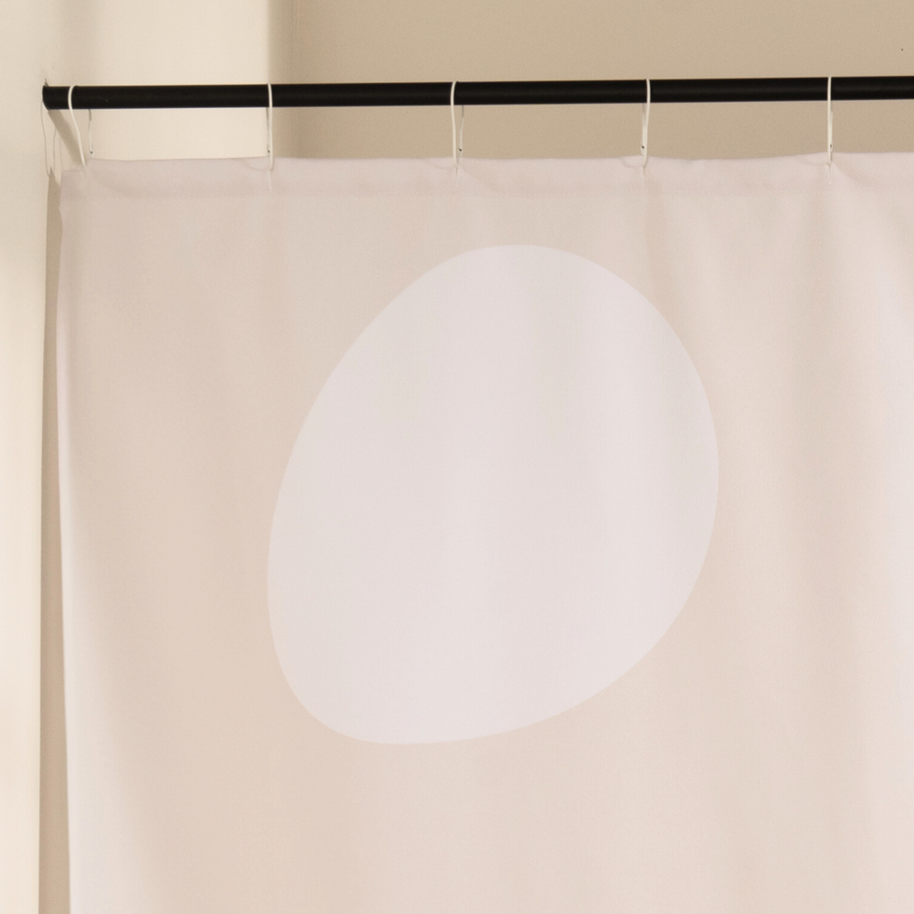 Close detail of the single black line looping over the cream cloth