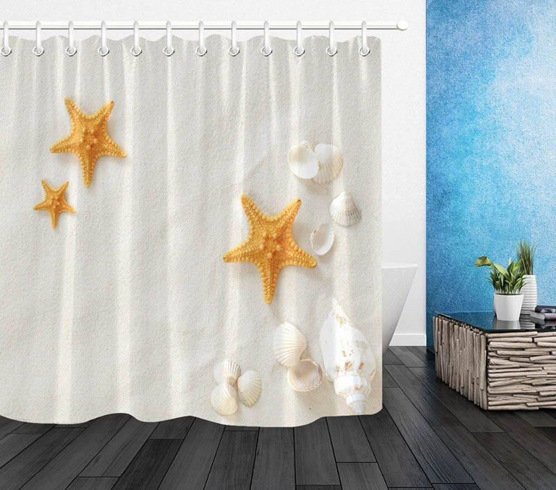 Off white cream sand with white shells and orange starfish resting on it