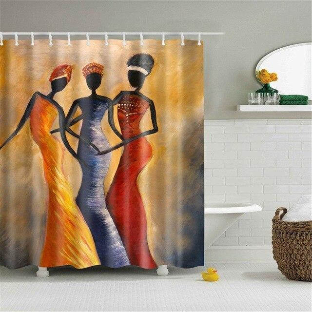 Three stylised African women in orange and red dresses on brushed ochre brown