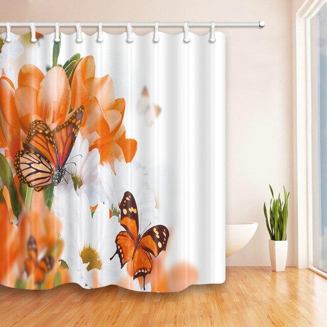 Large orange flowers and white daisies with two monarch butterflies resting on them