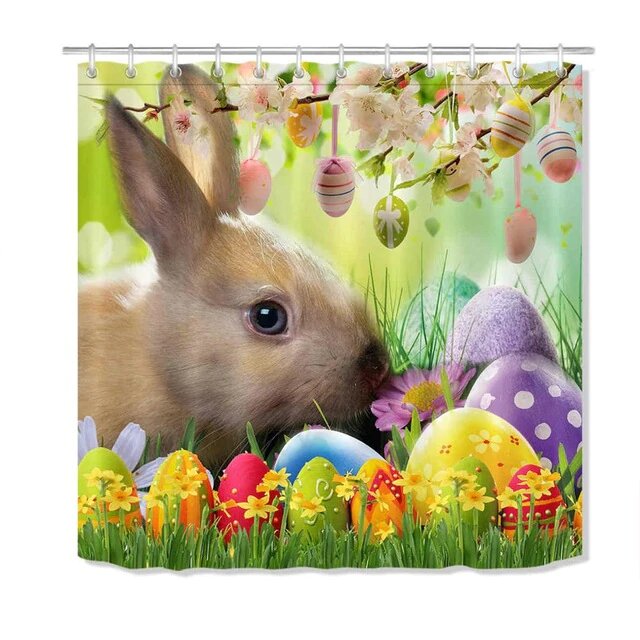 Pastel painted eggs along the hem with a beige bunny in soft green
