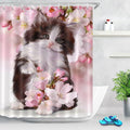 Chocolate brown and white kitten on a pink gradient with cherry blossom