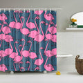 Bright pink flamingos outlined in black repeating over a greyed petrol blue ground