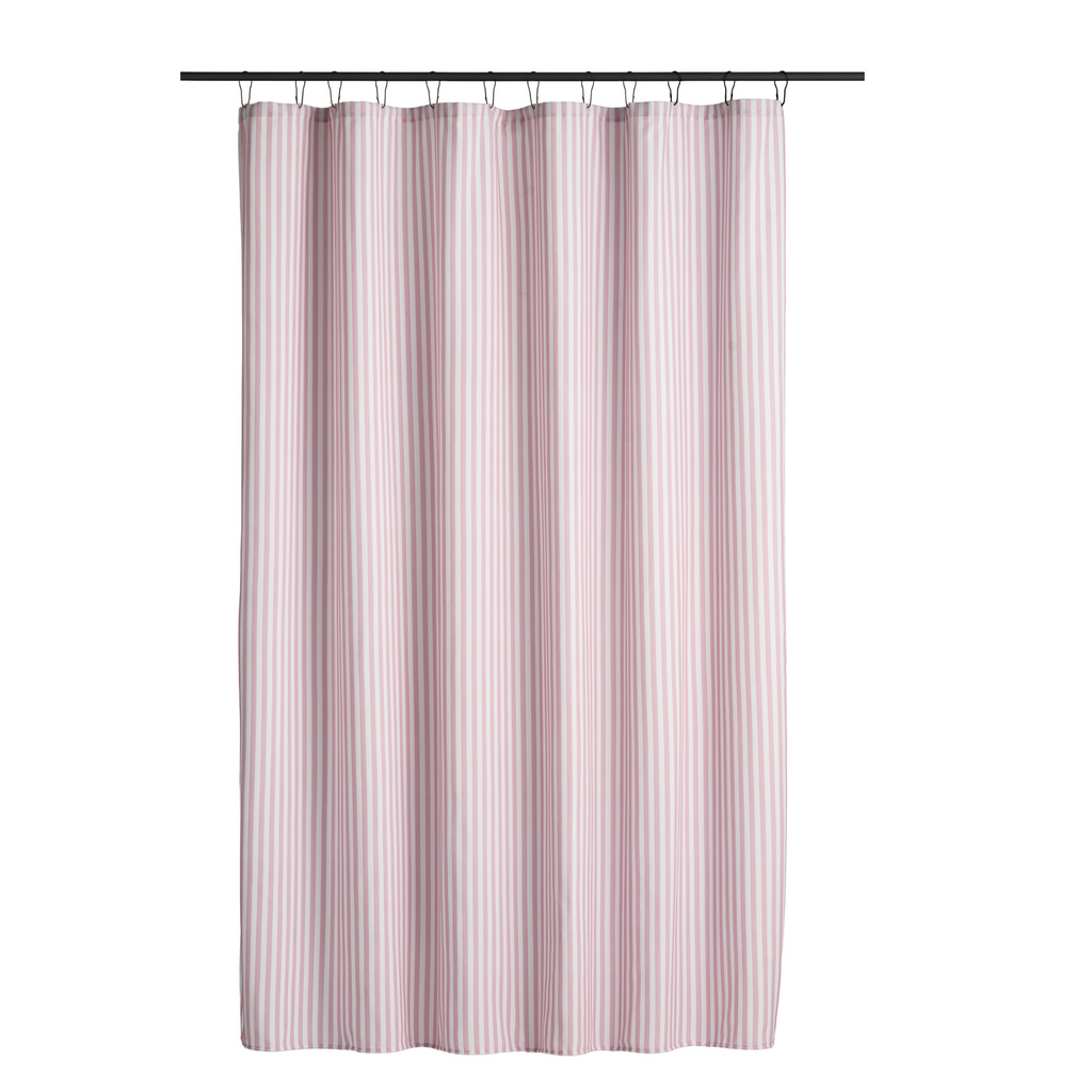 Pink striped curtain styled in a bright bathroom with pale tiling