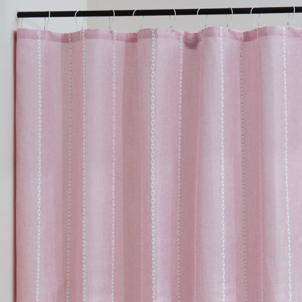 Close detail of the pink weave showing its matte textile surface