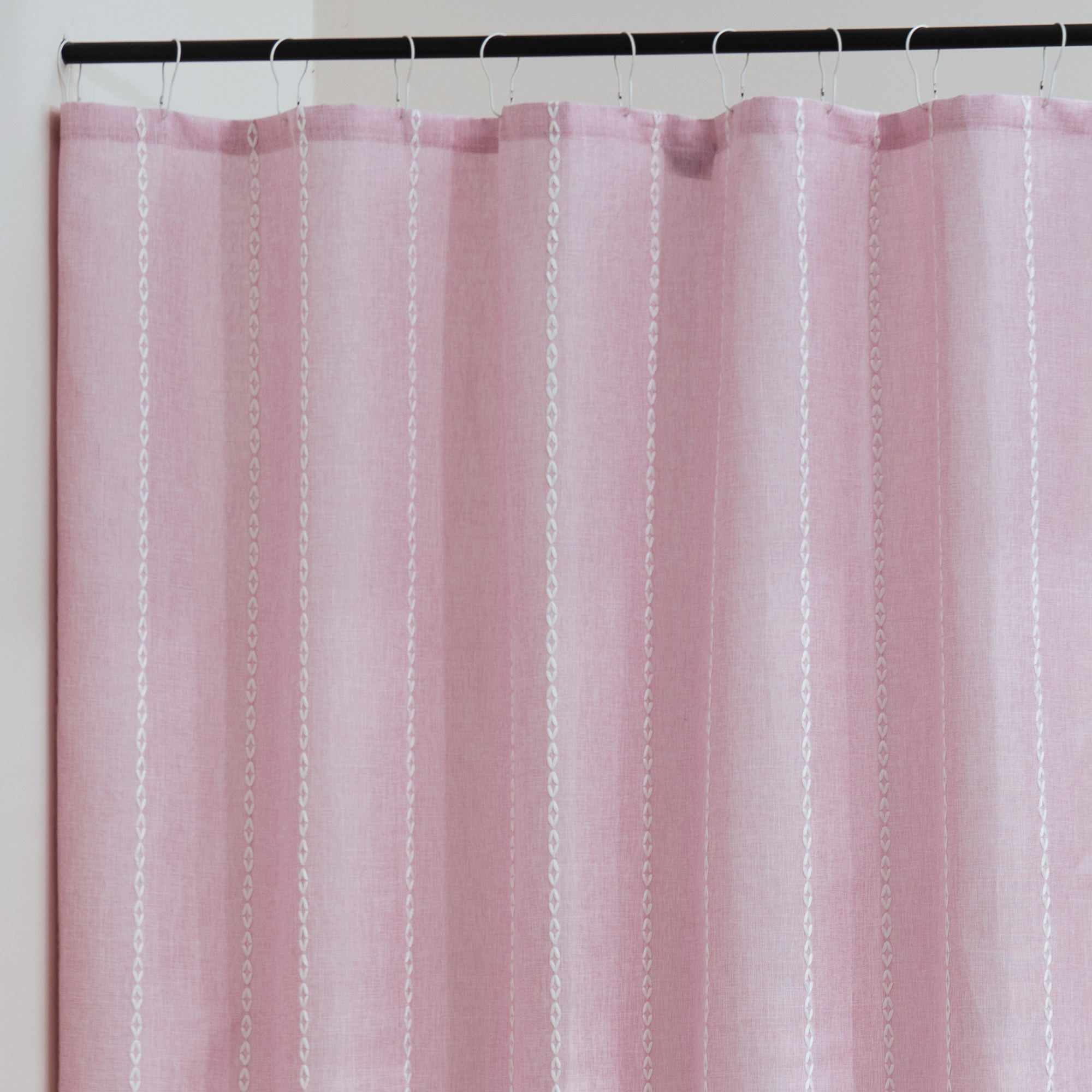 Close detail of the pink weave showing its matte textile surface