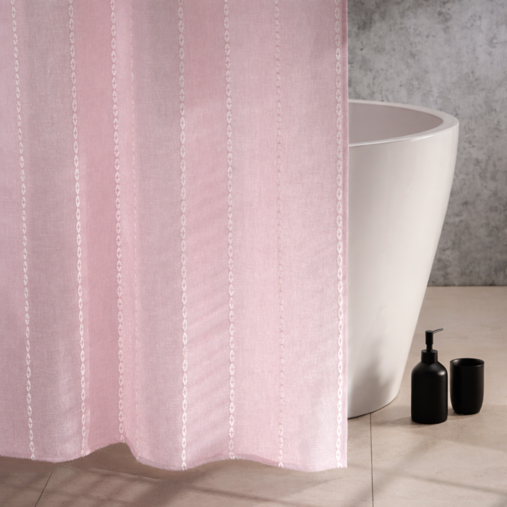 Powder pink curtain styled in a bright bathroom with pale tiling