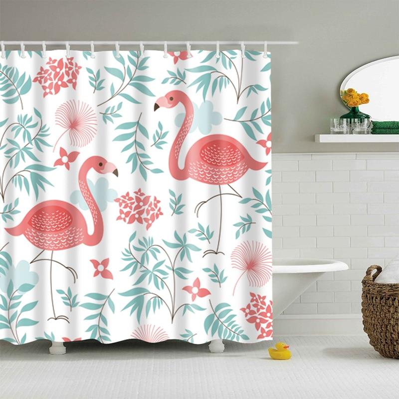 Two pink flamingos among scattered pink flowers and grey green foliage on white