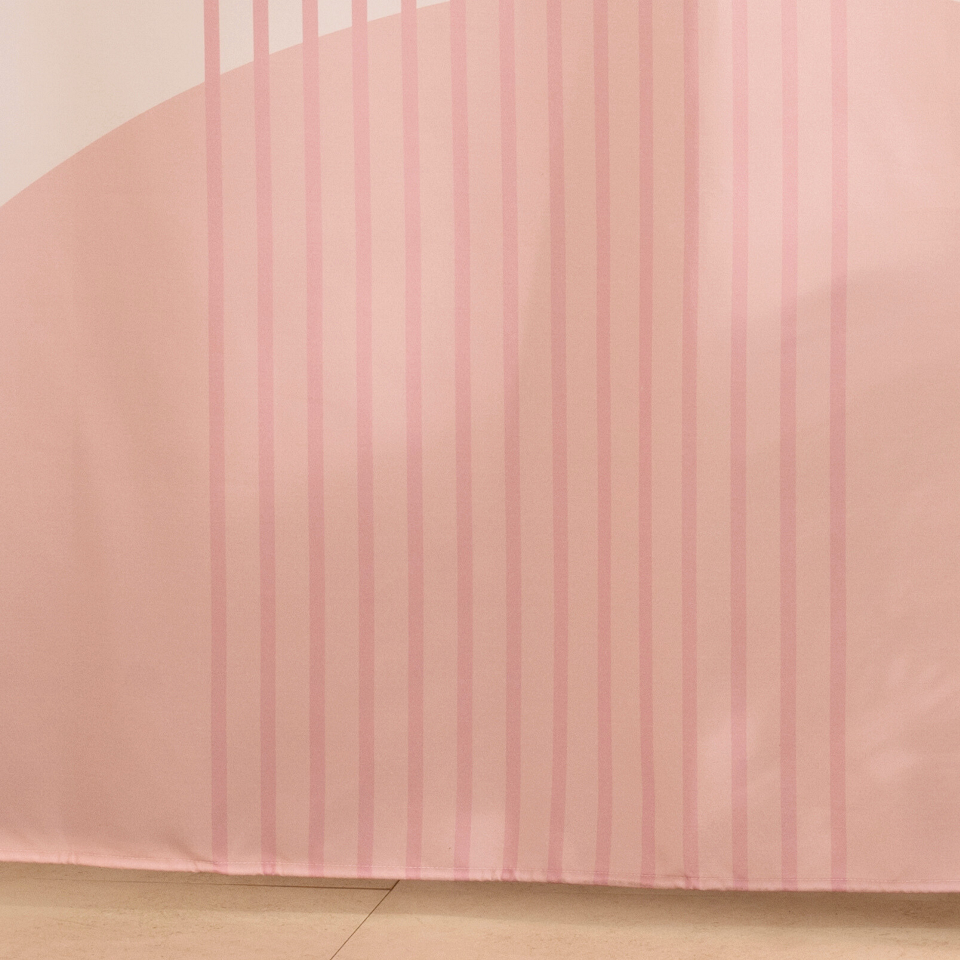Close detail of the retro pink arcs on the faded cream ground