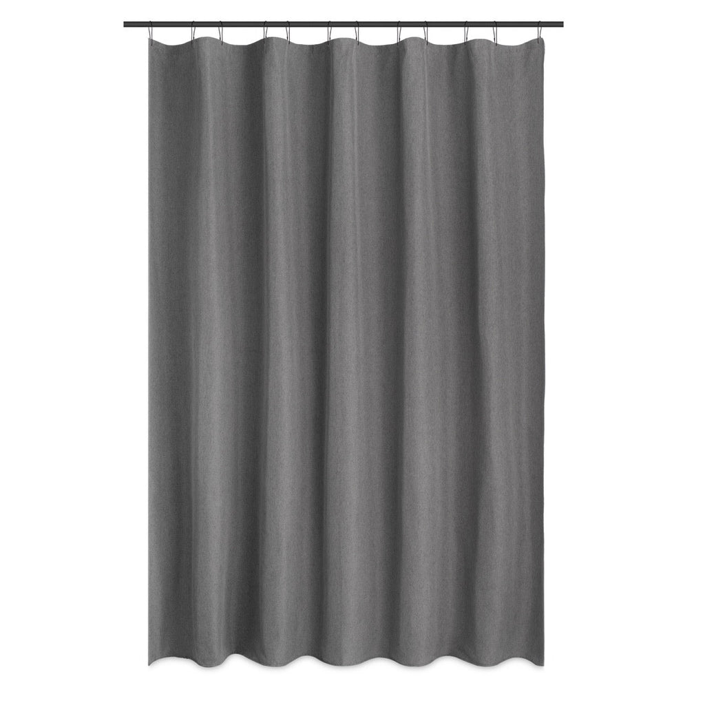 Plain grey curtain styled in a simple bathroom with warm daylight