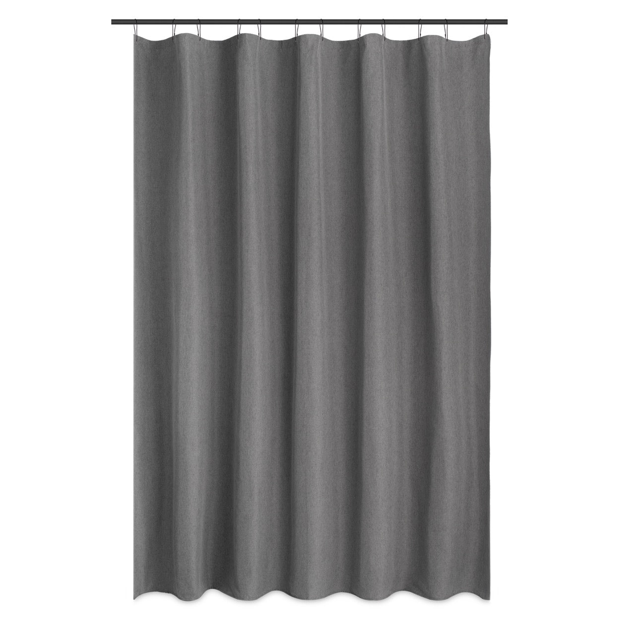 Plain grey curtain styled in a simple bathroom with warm daylight