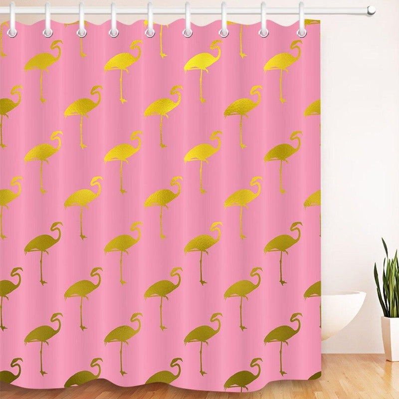 Close detail of a metallic gold flamingo against the pink fabric