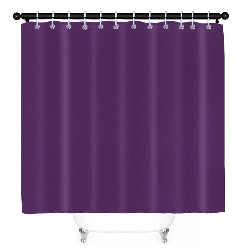 Plum purple panel hanging in even regular pleats on a rail