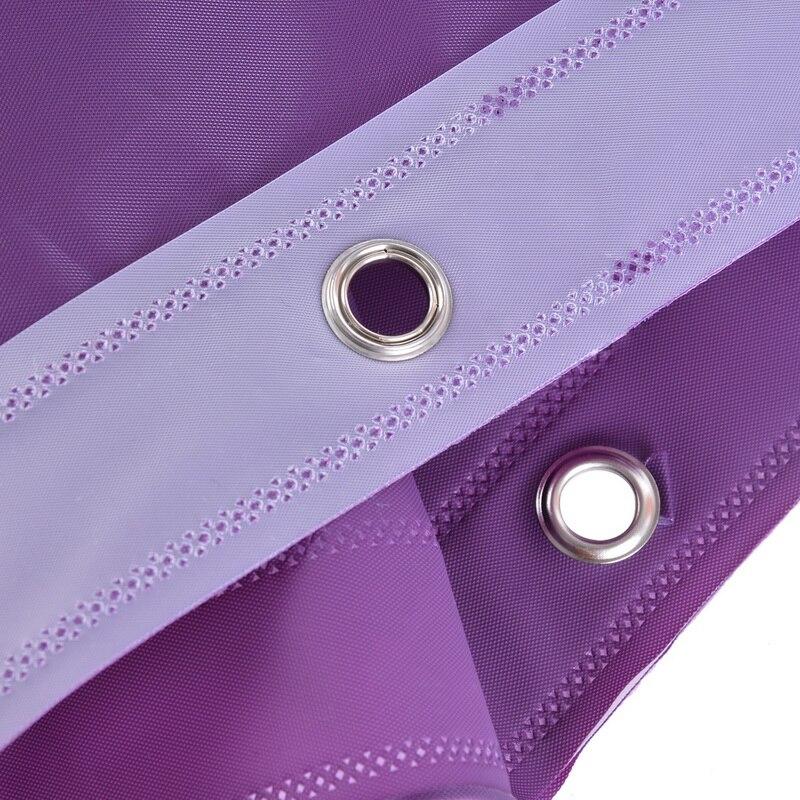 Plain plum purple fabric shown hanging in soft daylight indoors