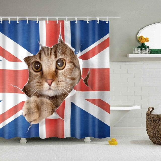 Red white and blue Union Jack with a tabby kitten pushing through a tear