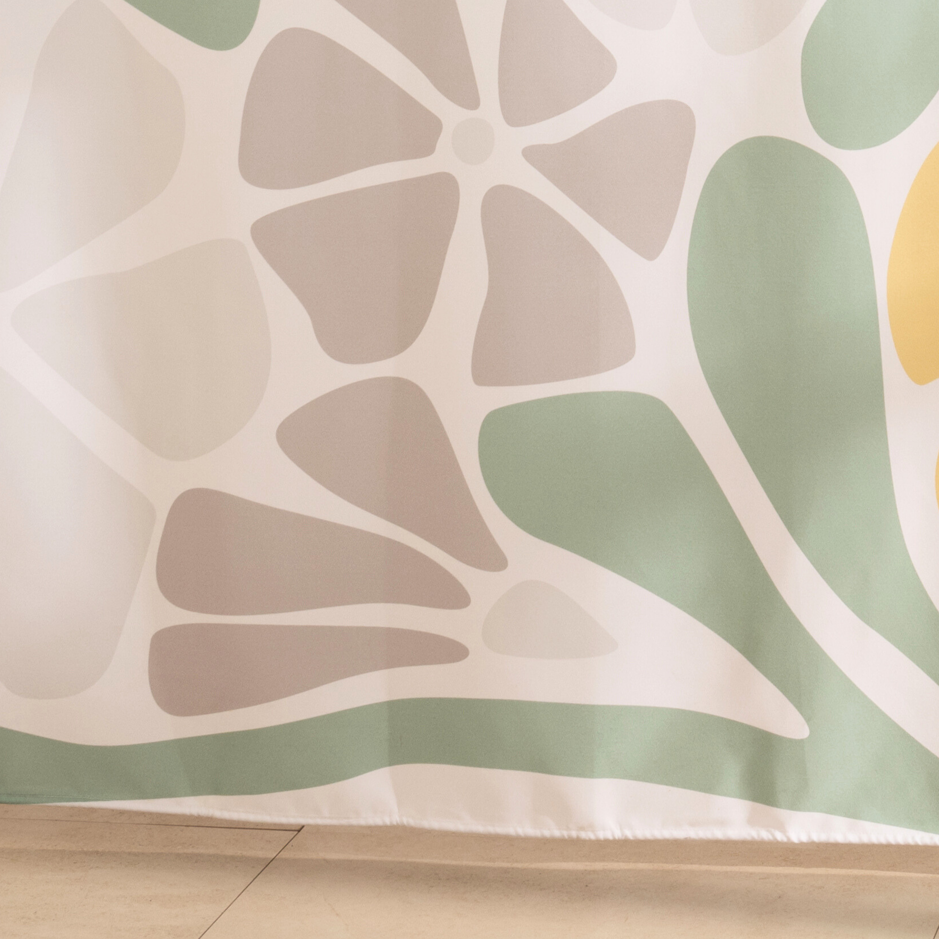 Full length retro daisy curtain hanging beside a glass screen
