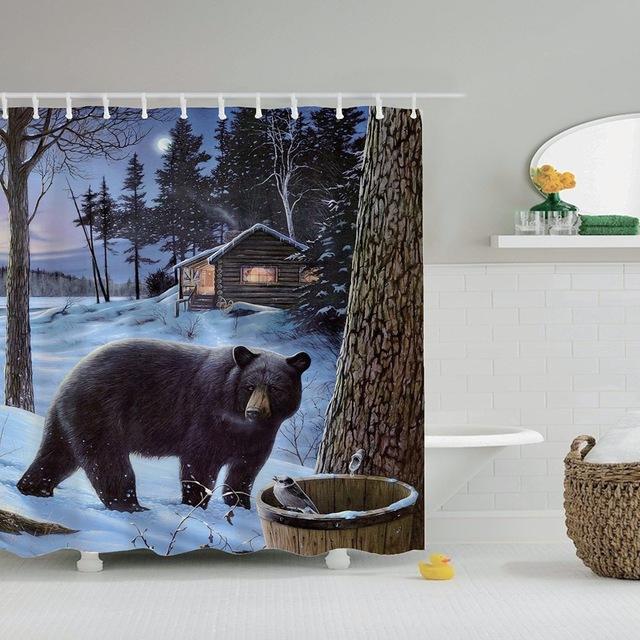 Black brown bear walking through snow past a lit log cabin and snowy firs