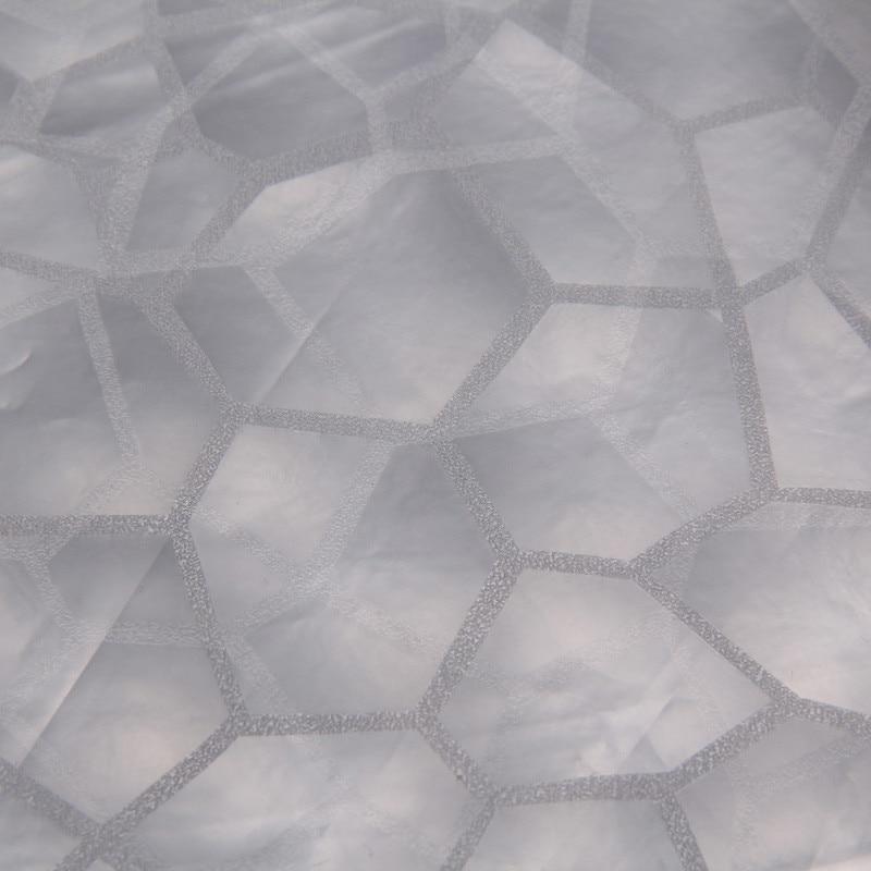 Close detail of the diamond relief and the taps visible through it