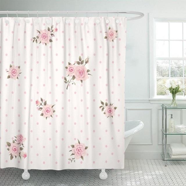 Pastel rose posies scattered across a pink polka dot fabric ground