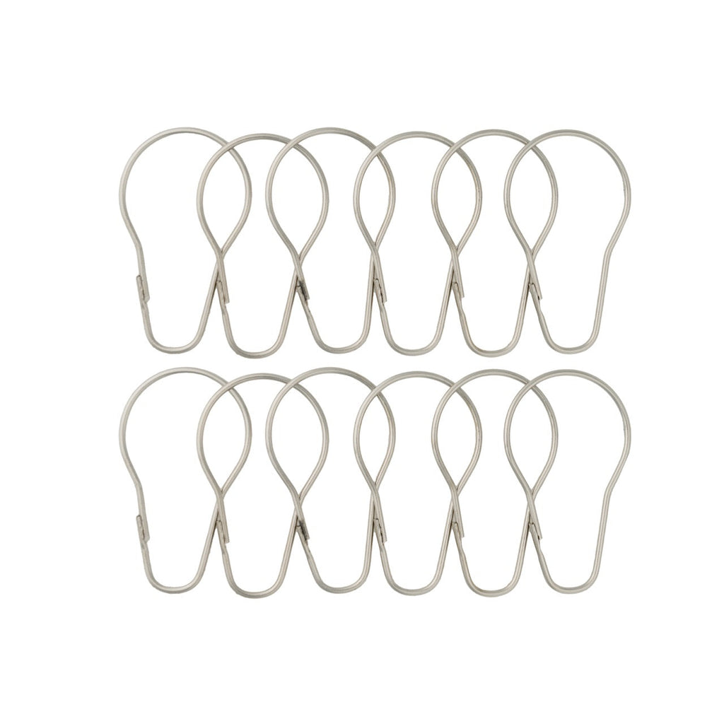 Twelve satin silver pear shaped rings laid out in two rows of six