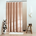 Soft nude beige panel with a waffle grain lit by raking daylight