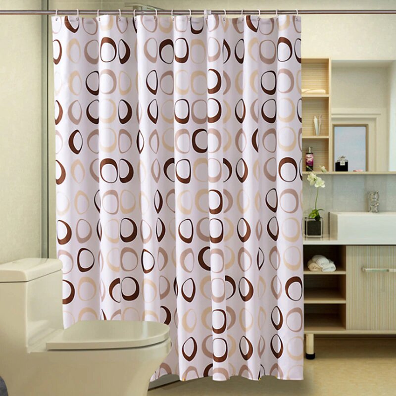 Brown and beige rings and circles printed on a cream ground