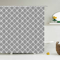 White quatrefoil trellis repeating across a mid grey curtain panel