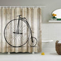 Black penny farthing bicycle silhouette against weathered beige and brown wood planks