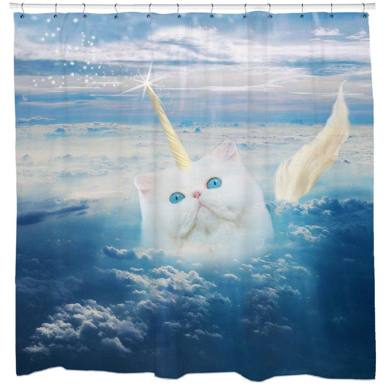 White kitten with a golden horn on a blue sky above a sea of clouds